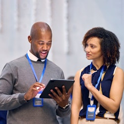 convention attendee using an iPad